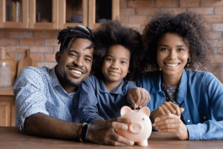 Parents teaching their child to save money