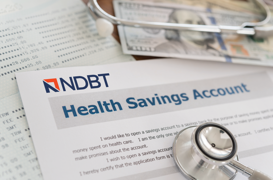 NDBT health savings account form on desk with stethoscope