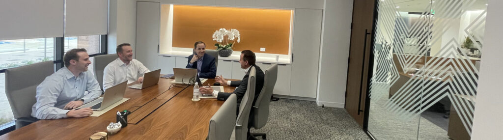 Bankers meeting with customers in NDBT's conference room at the Dallas Banking Center.