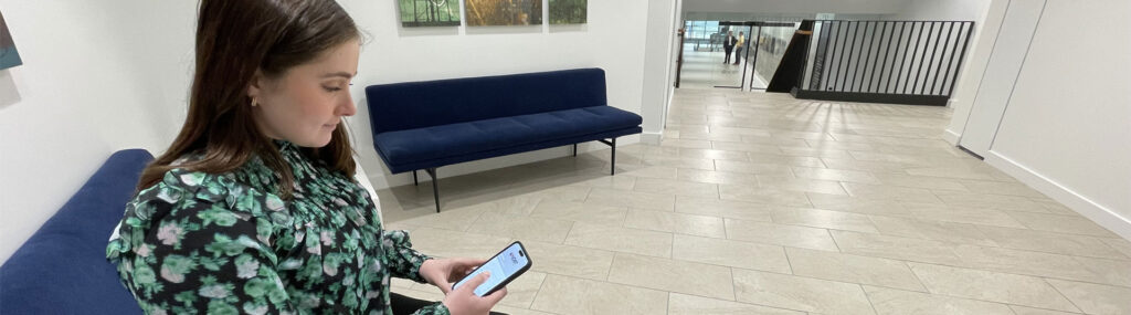Customer using NDBT's business online banking app through their mobile device.