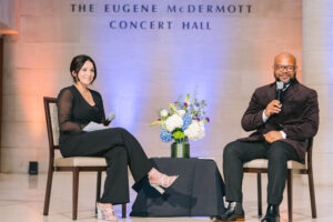 NDBT Cares lead Lisa Rushing and guest J.A. Anderson on The Eugene McDermott Concert Hall stage