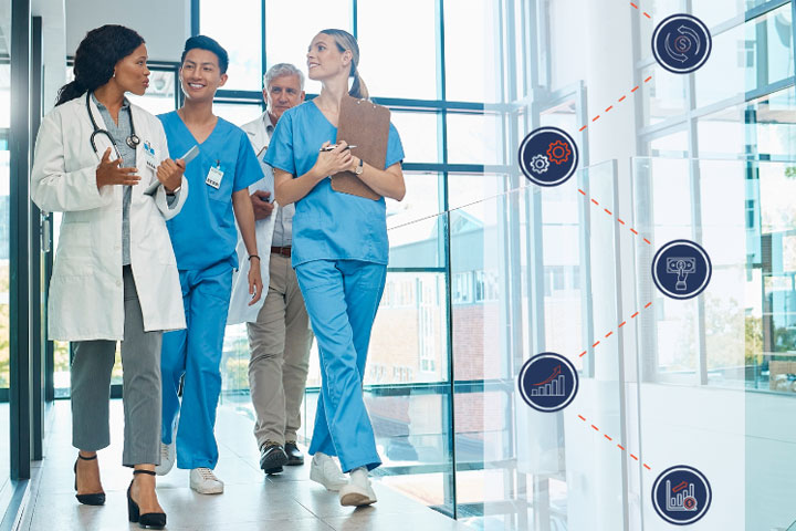 Doctors walking through hospital hallway with medical journey icons on the side