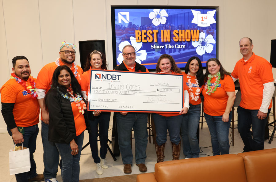 Representatives from Irving Cares and NDBT presented check in NDBT lobby