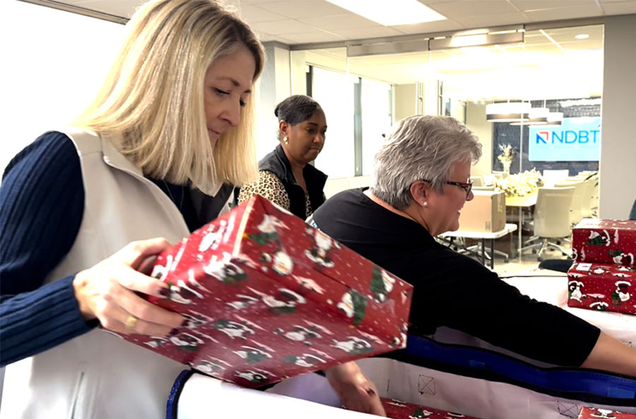 NDBT professionals wrapping presents