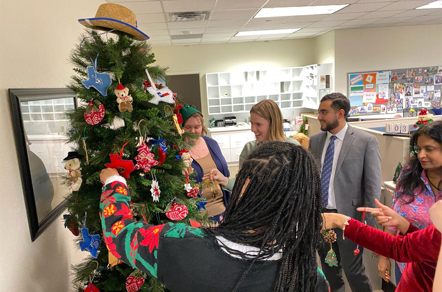 NDBT employees decorating tree