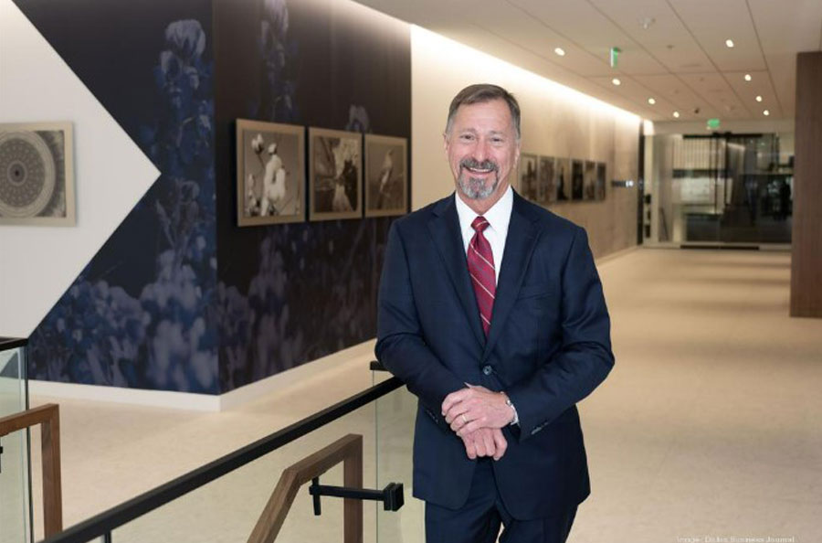 CEO Larry Miller in bank hallway