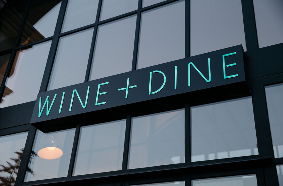 Sixty Vines Uptown Wine + Dine sign