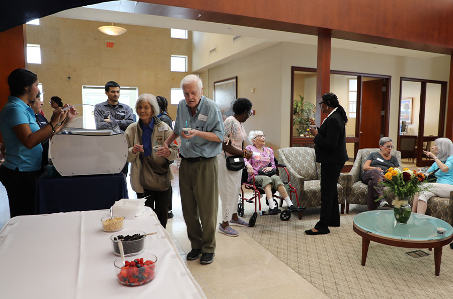Neighbors from Bonaventure enjoying ice cream in Addison lobby