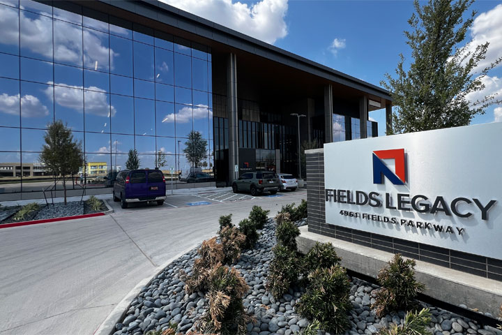 Fields Legacy marquee sign with building in background